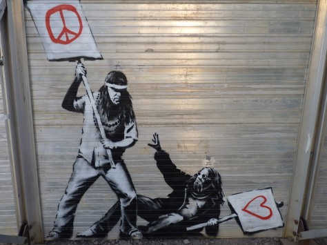 banksy peace and love